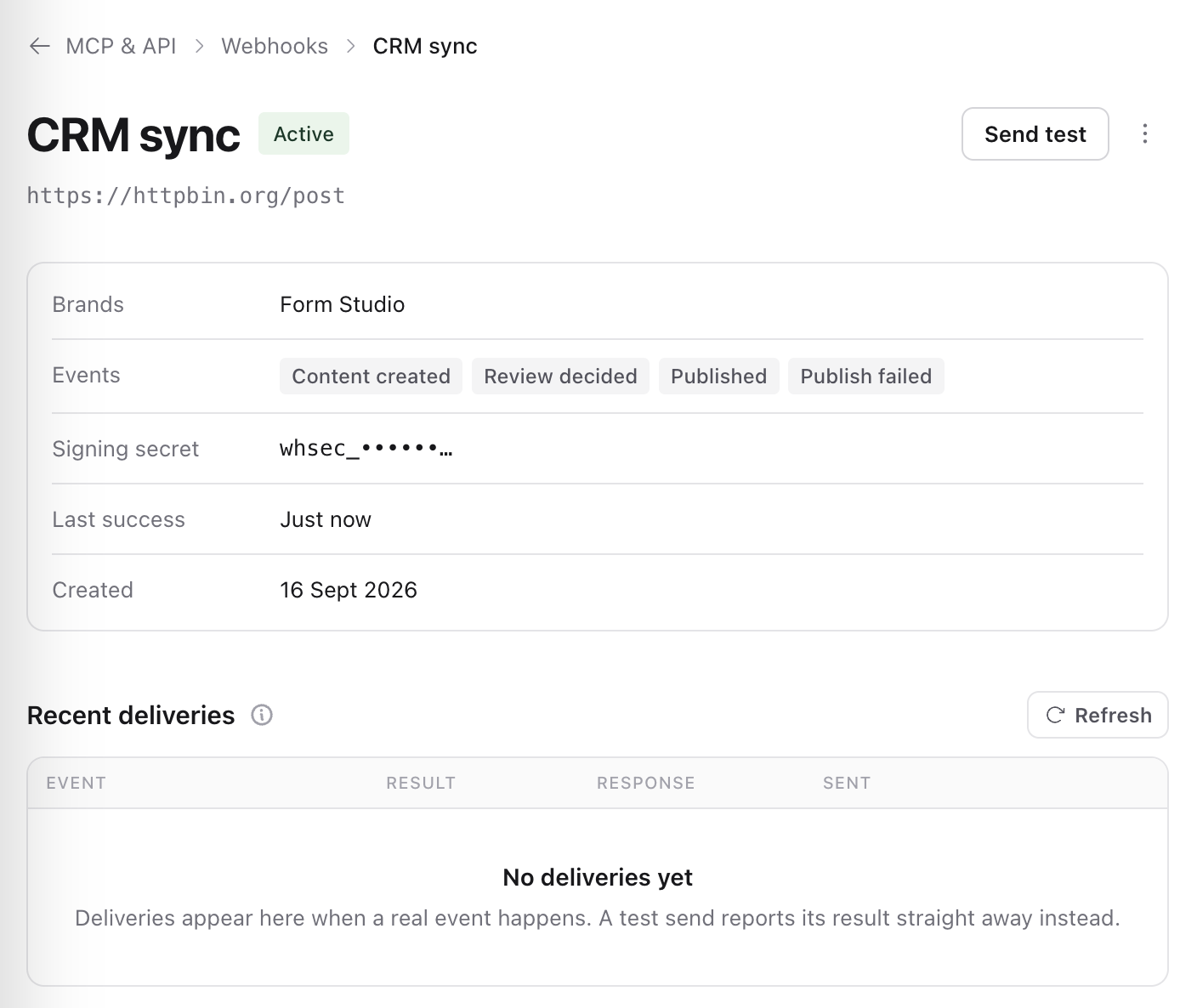 CRM sync webhook page with Send test, its brands, events, masked signing secret, last success and recent deliveries