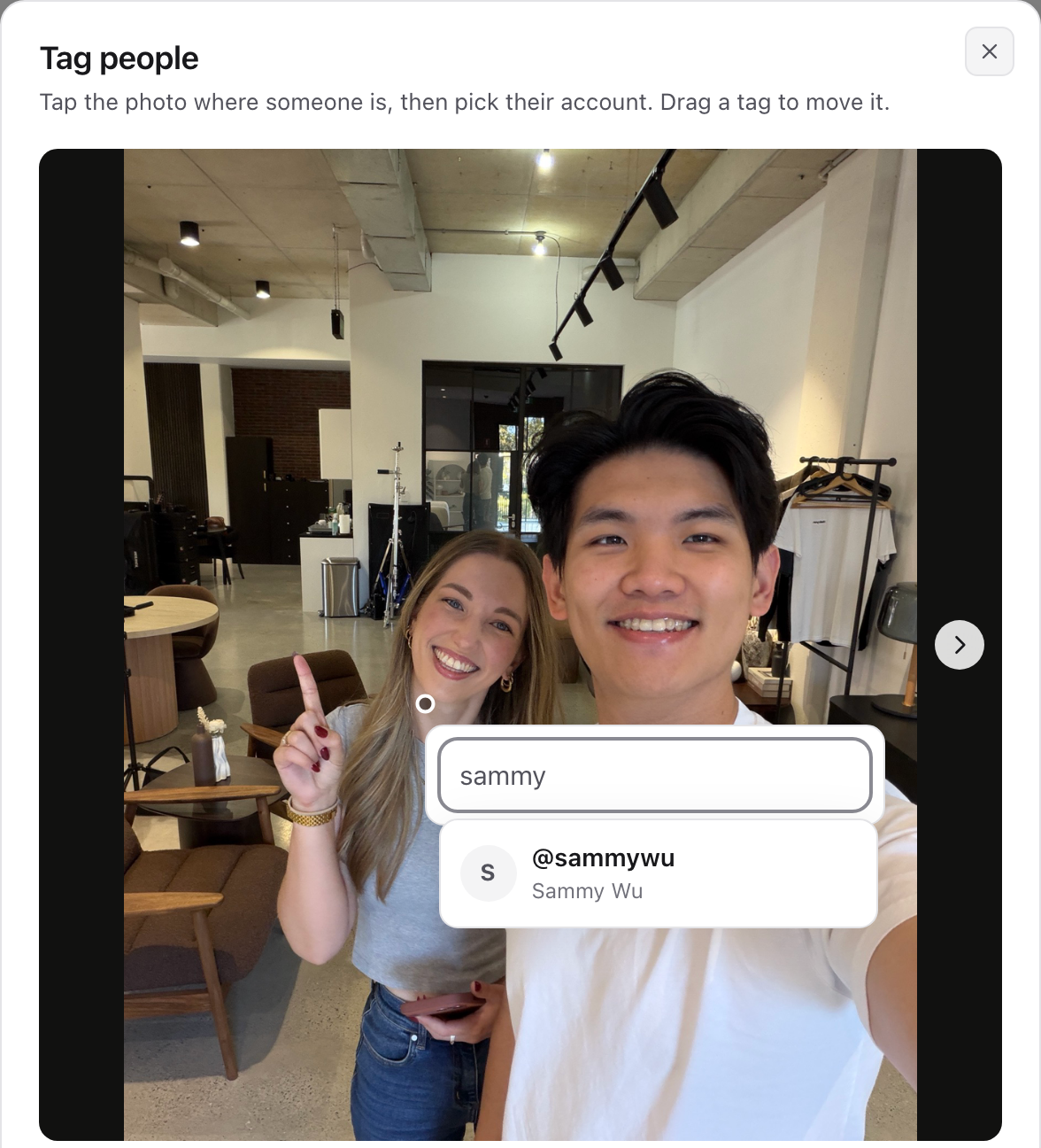 The Tag people window with a spot tapped on the photo and the account search showing @sammywu.