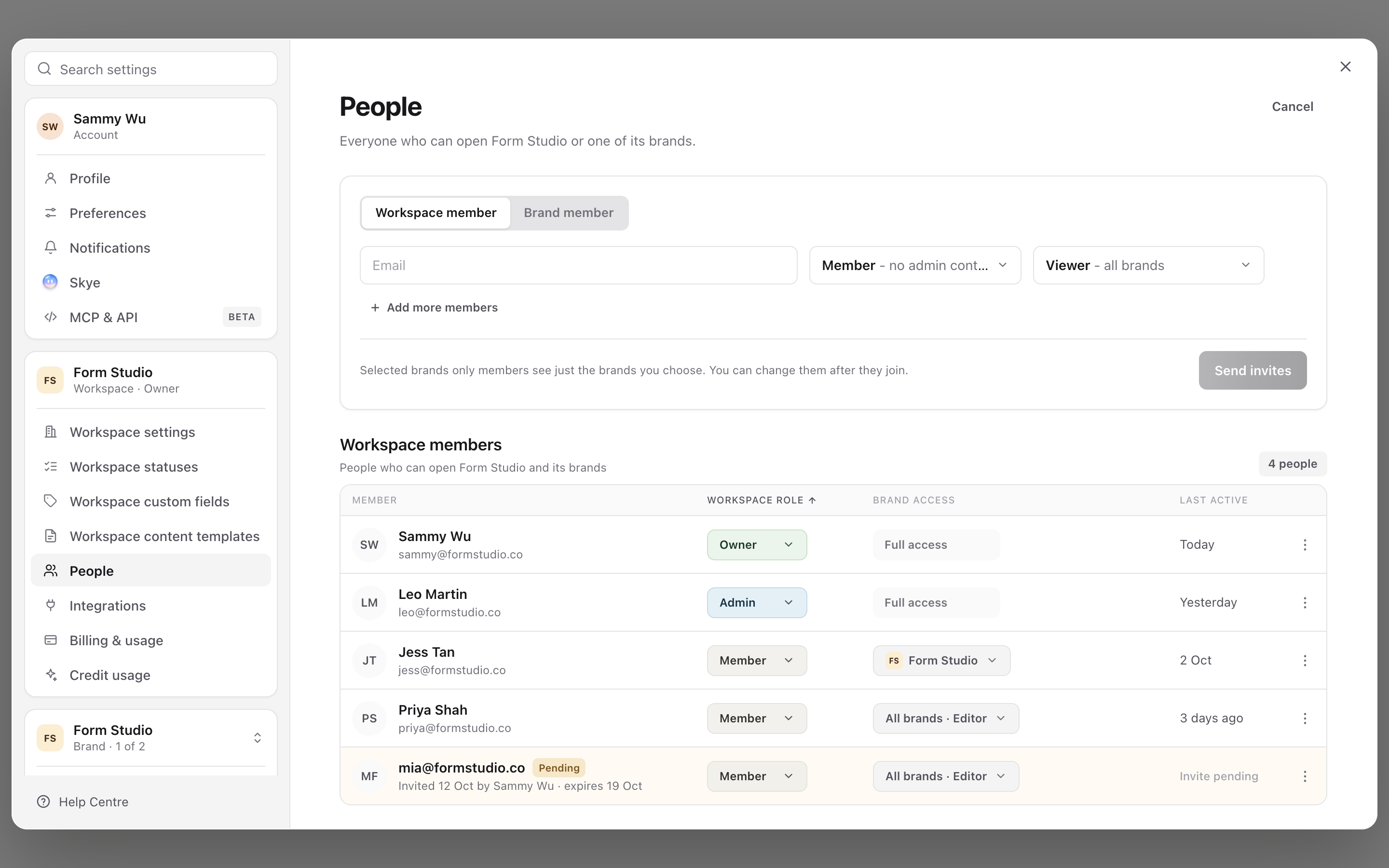 Invite people form with an email field, the workspace role set to Member and brand access set to Viewer for all brands